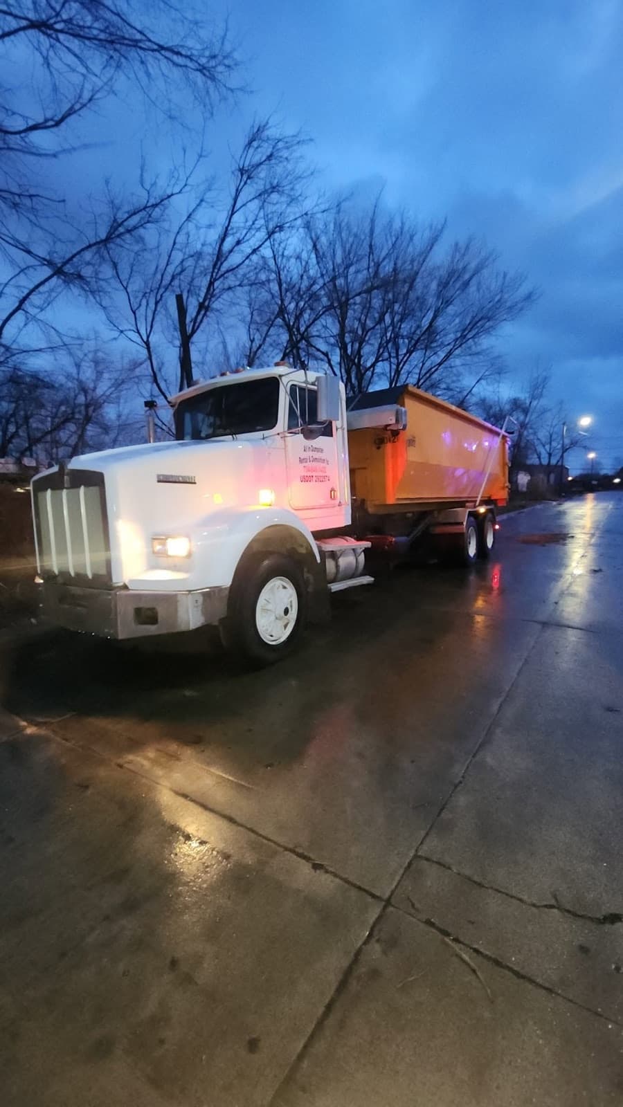 All In Dumpster Rentals roll-off truck on an early dumpster delivery in the Downriver area